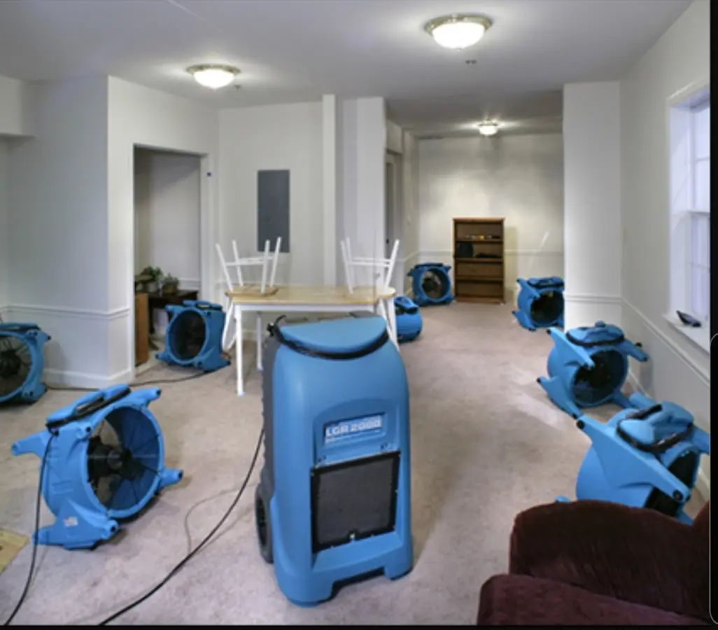 Air movers and dehumidifier setup for Water Damage Restoration in Granville